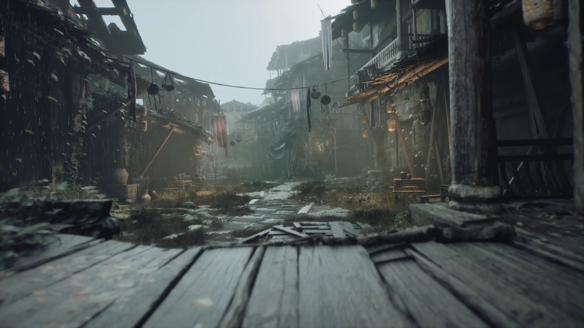 Official Phantom Blade Zero screenshot of a misty, rain-soaked village street lined with weathered wooden houses, seen from a broken wooden walkway.