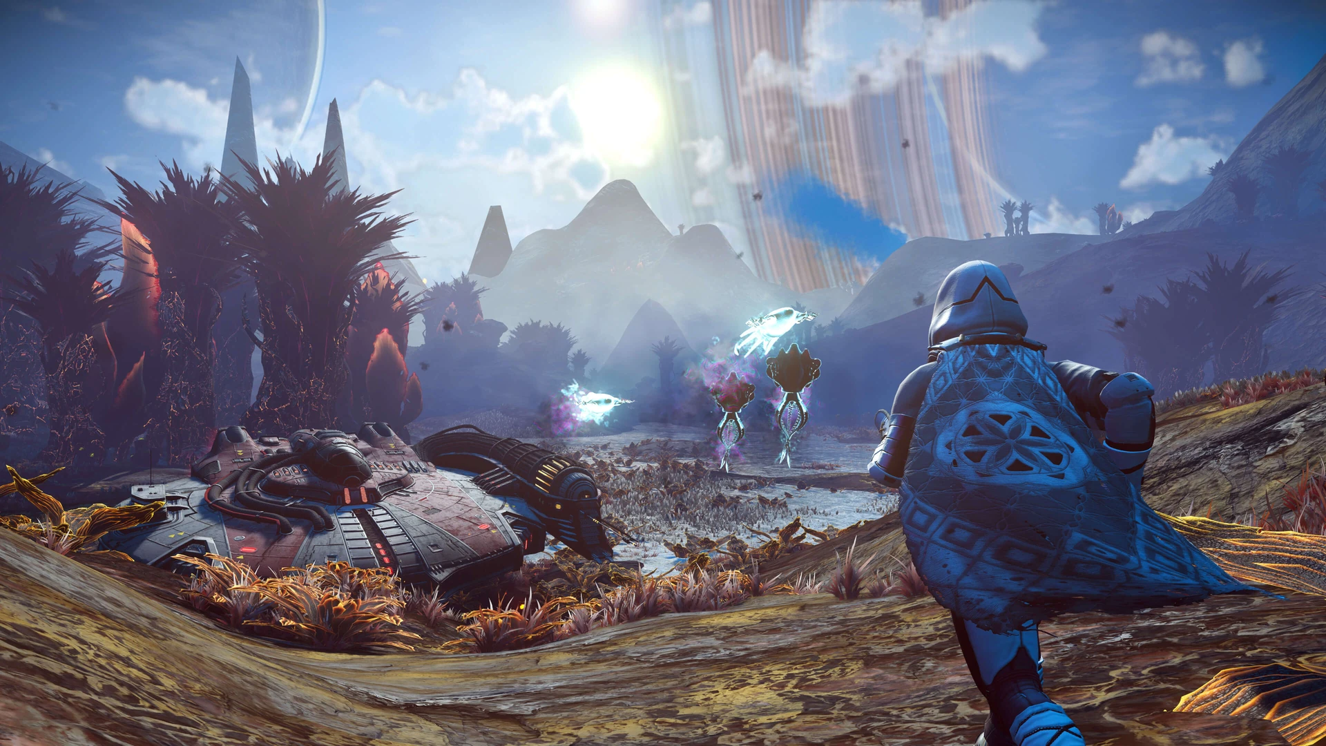 A caped explorer in a blue suit runs across an alien landscape of tall dark plants toward a crashed ship, with glowing creatures nearby and a ringed planet in the sky.